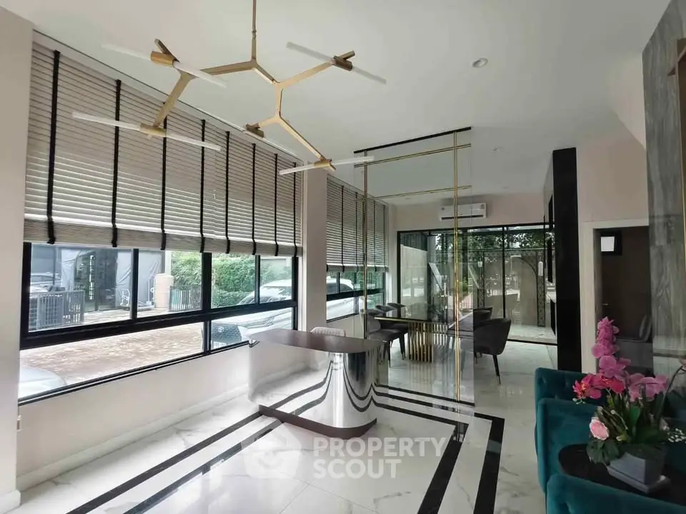 Luxurious modern living room with elegant decor and large windows