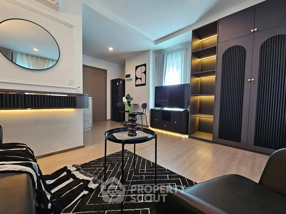Modern living room with stylish decor, sleek furniture, and ambient lighting for a cozy atmosphere.