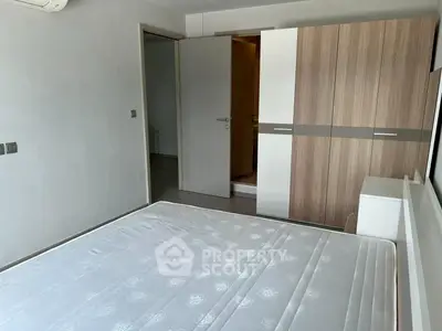 Modern bedroom with minimalist design and spacious wardrobe
