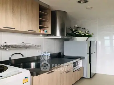 Modern kitchen with sleek cabinetry and stainless steel appliances