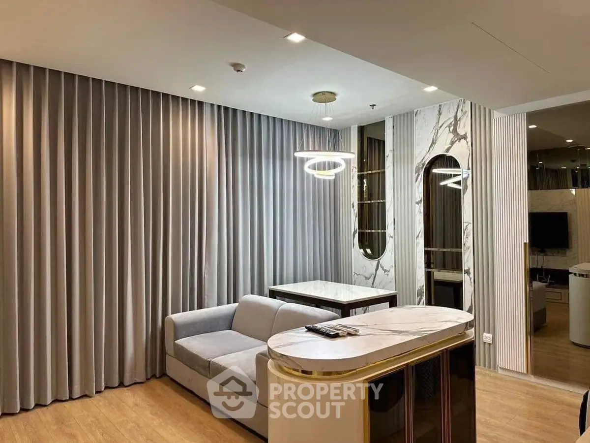 Luxurious modern living room with elegant marble accents and stylish lighting