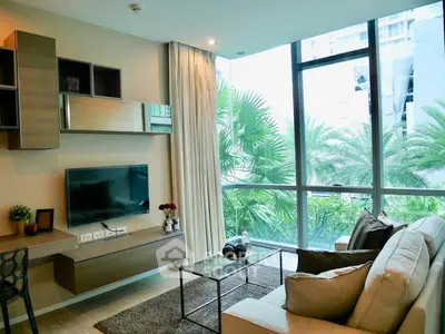 Modern living room with large windows and stylish decor in urban apartment
