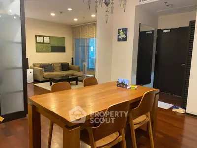 Modern living room with wooden dining table and cozy seating area