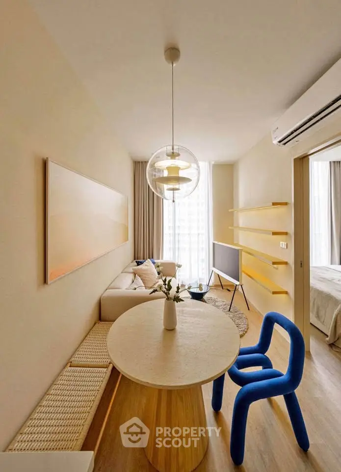 Modern living room with unique blue chair and stylish decor