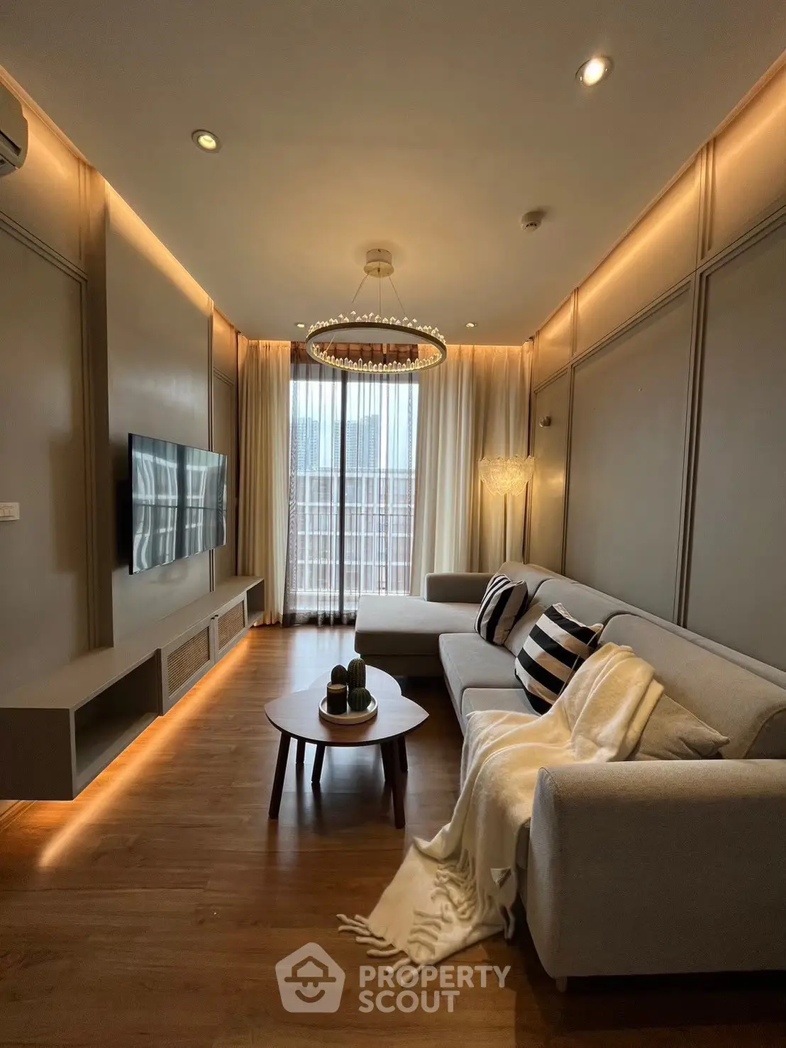 Luxurious modern living room with elegant lighting and cozy seating area.