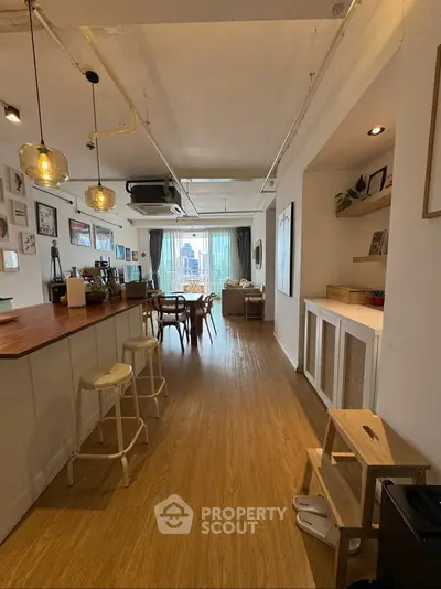 Spacious open-plan living area with modern kitchen and stylish decor