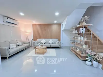 Spacious modern living room with elegant decor and ample natural light