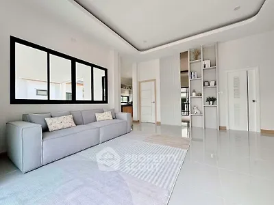 Spacious modern living room with elegant decor and large windows