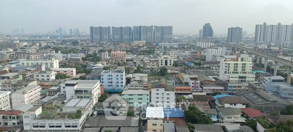 Panoramic cityscape view showcasing diverse urban architecture and high-rise buildings.