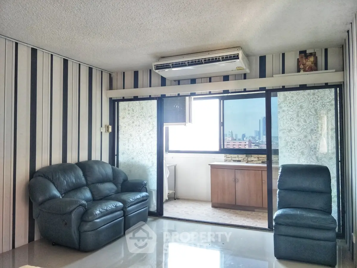 Spacious living room with modern decor and city view