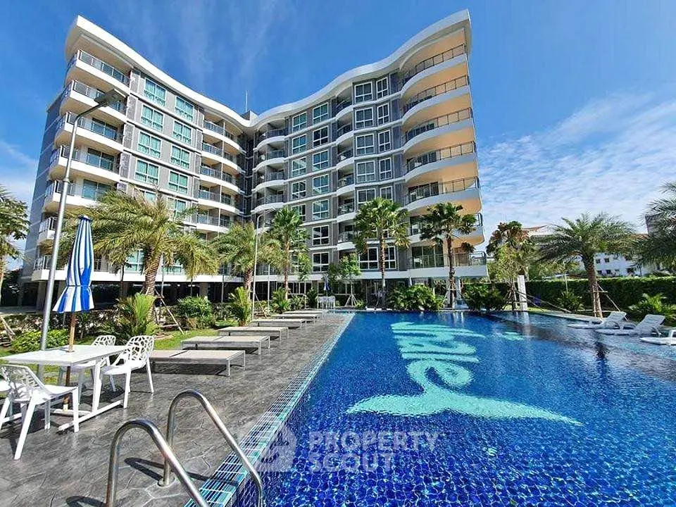 Luxurious condominium with stunning pool and modern architecture, perfect for resort-style living.