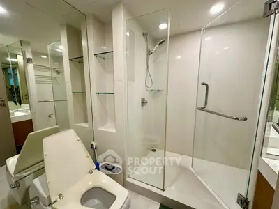 Modern bathroom with glass shower and sleek fixtures