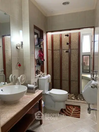 Modern bathroom with stylish fixtures and unique shower design