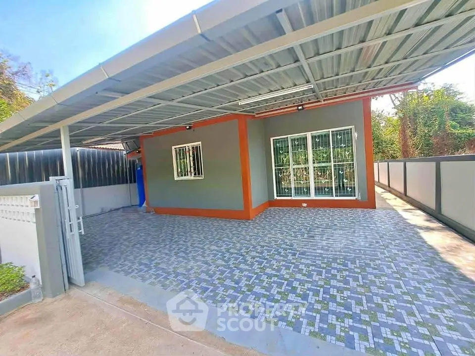 Modern single-story home with spacious covered carport and stylish exterior design.