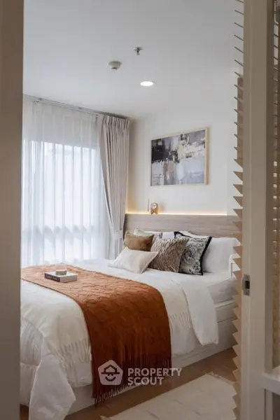 Cozy modern bedroom with stylish decor and natural light