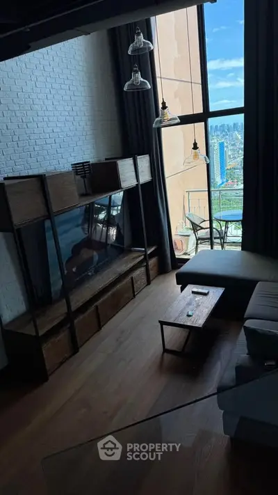 Stunning modern living room with floor-to-ceiling windows and city skyline view.