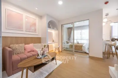 Stylish modern living room with cozy decor and open layout to bedroom