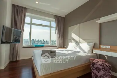 Luxurious bedroom with city view, modern decor, and natural light.