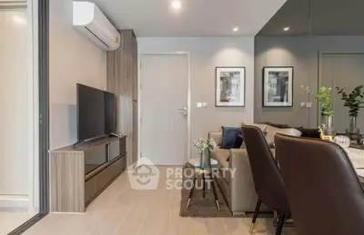 Modern living room with sleek furniture and wall-mounted TV, perfect for urban lifestyle.