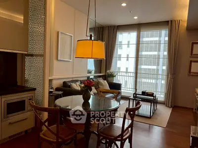 Chic living room with modern decor and large windows in a stylish apartment.