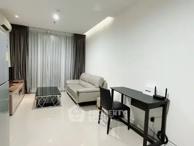 Modern living room with sleek furniture and natural light, perfect for relaxation and entertainment.