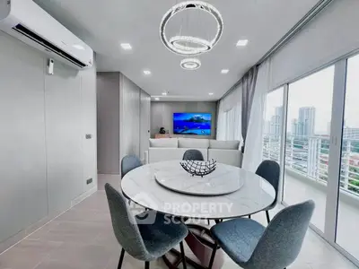 Modern living room with elegant dining set and city view balcony.