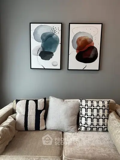 Stylish living room with modern art and cozy sofa, perfect for contemporary urban living.