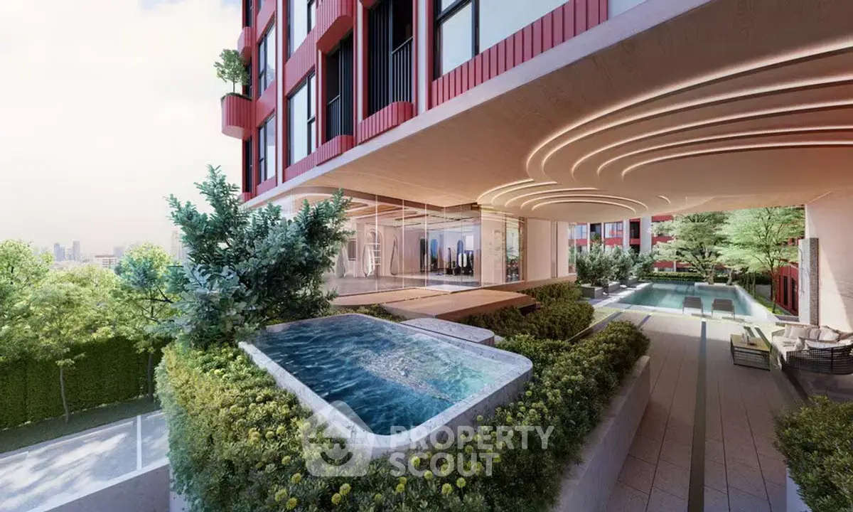 Luxurious modern building exterior with pool and lush greenery