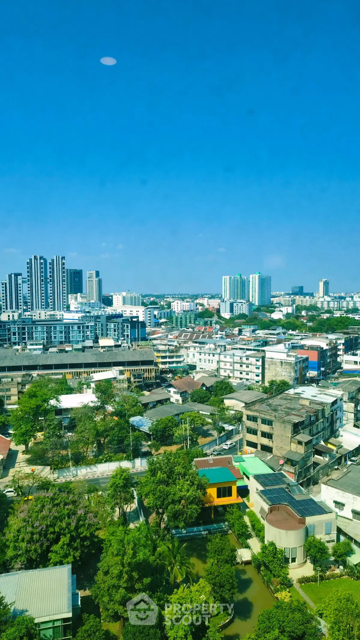 Stunning cityscape view showcasing modern skyline and lush greenery, perfect for urban living enthusiasts.