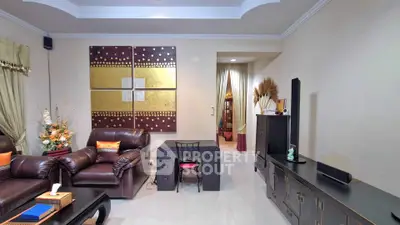 Elegant living room with leather sofas and modern decor in a stylish home.