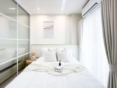 Bright and airy bedroom with modern decor and large window