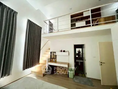 Modern loft-style bedroom with mezzanine and sleek design