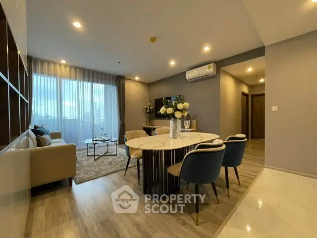 Modern living room with elegant dining area and stylish decor
