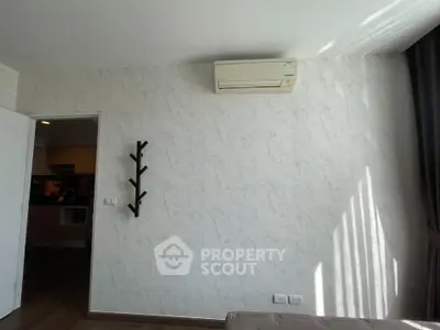 Modern living room with air conditioning and stylish wall decor