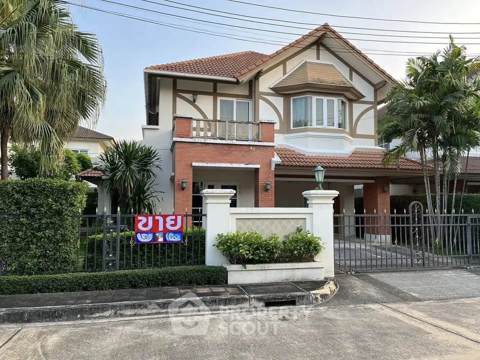Charming two-story house with lush garden and spacious driveway in a serene neighborhood.
