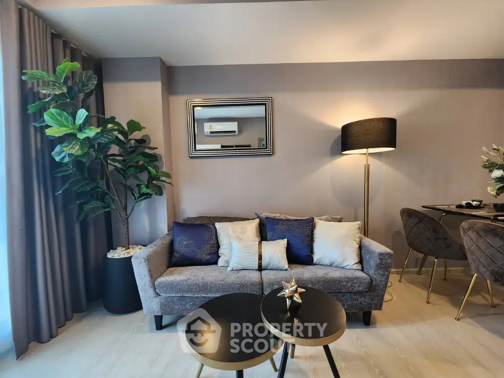 Elegant living room with modern furnishings, plush sofa, chic coffee tables, and tasteful decor, perfect for urban living.