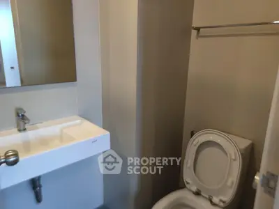 Modern bathroom with sleek sink and toilet in a minimalist design