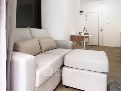 Modern living room with cozy sofa and dining area in stylish apartment.