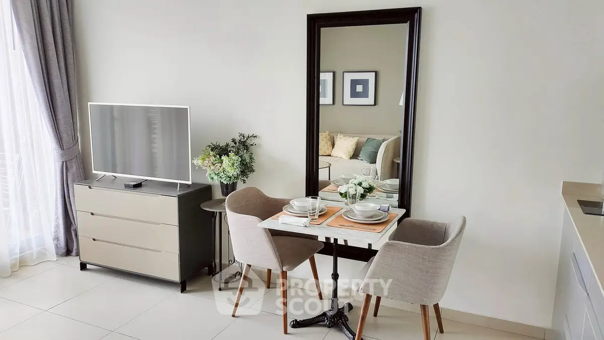 Modern living room with elegant dining setup and stylish decor