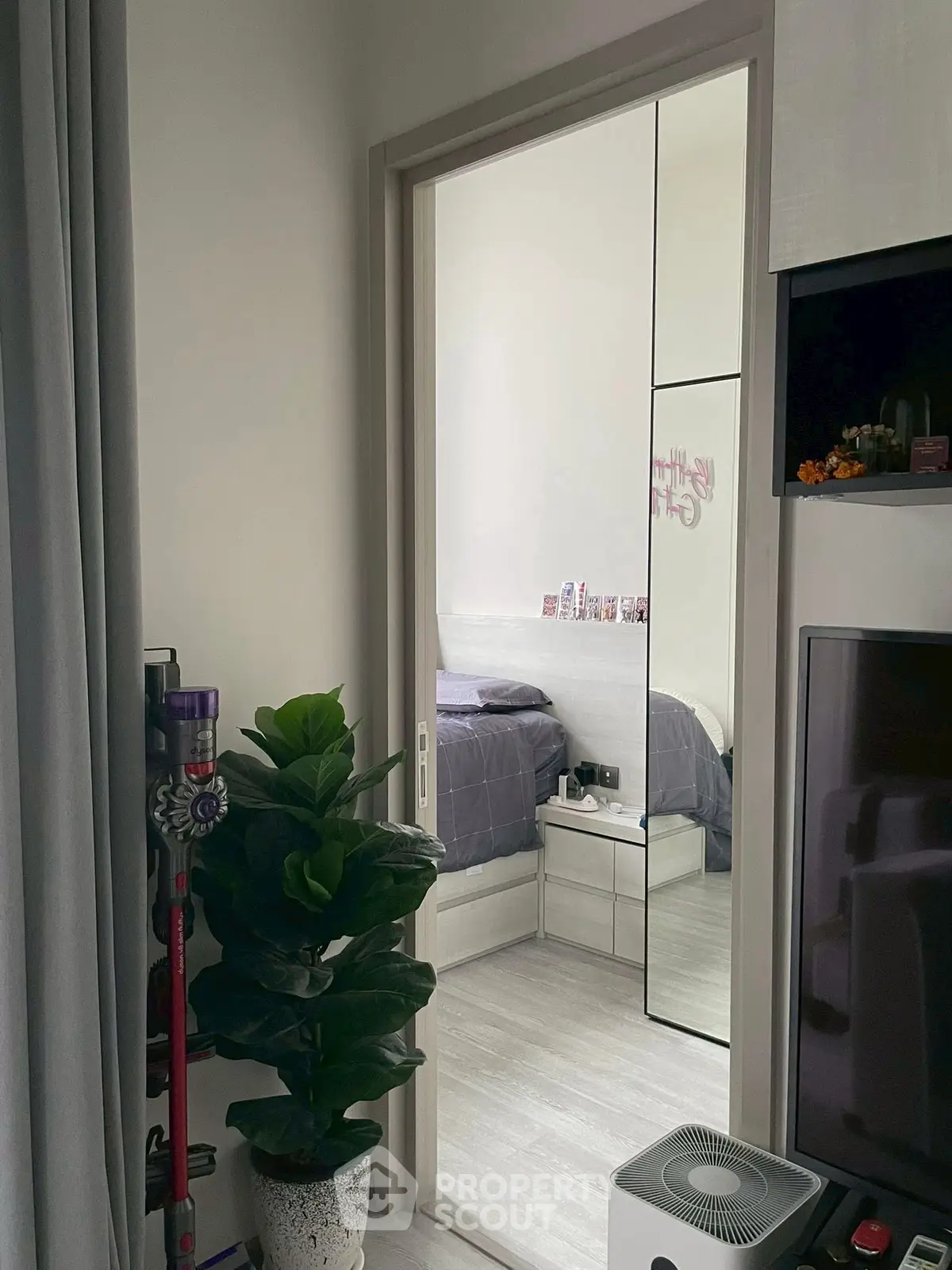 Modern bedroom with mirrored closet and stylish decor