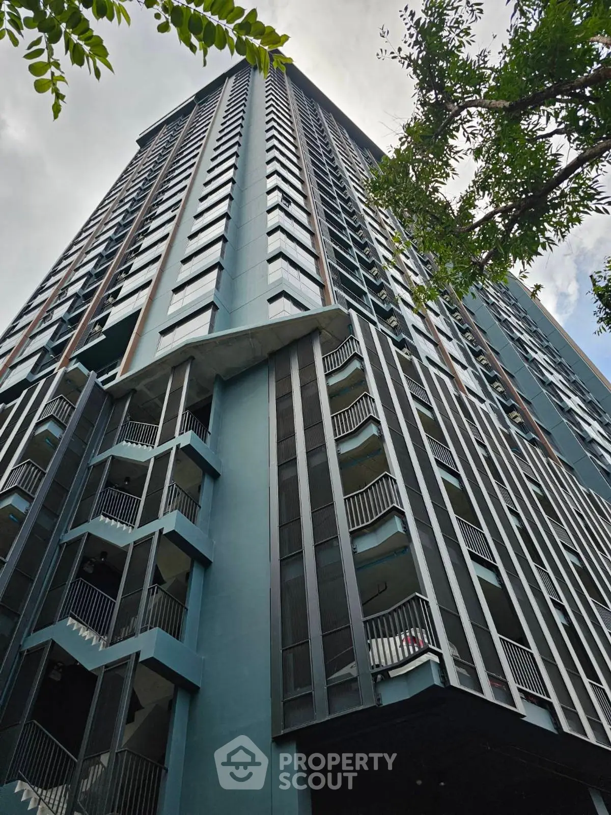 Stunning modern high-rise building with sleek design and expansive balconies.