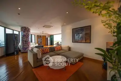 Spacious modern living room with large windows and stylish decor