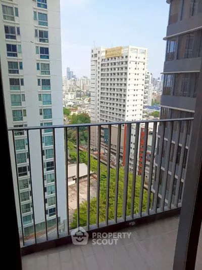 High-rise balcony with cityscape view, perfect for urban living enthusiasts.