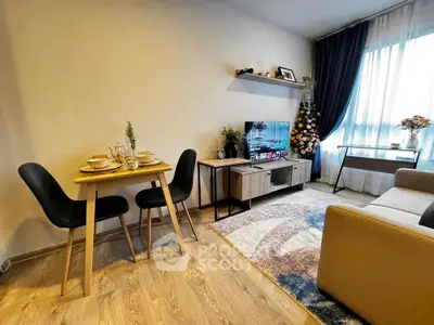Cozy living room with modern decor, dining area, and natural light.