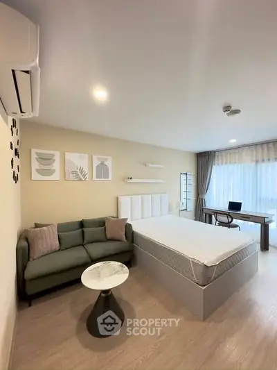 Modern studio apartment with cozy bed and stylish decor