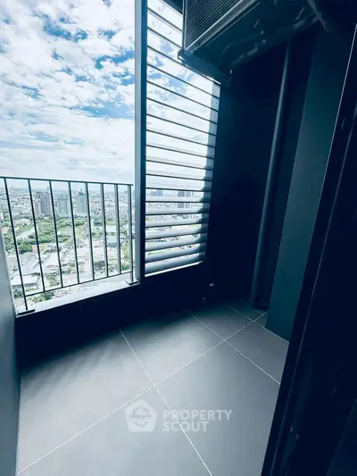 Modern balcony with panoramic city view and sleek design.