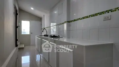 Sleek modern kitchen with gas stove and minimalist design