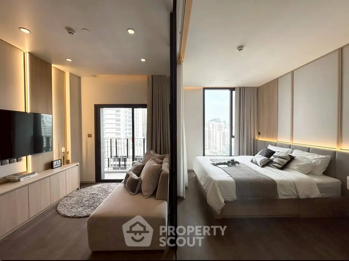 Modern apartment with stylish living room and cozy bedroom, featuring large windows and city views.
