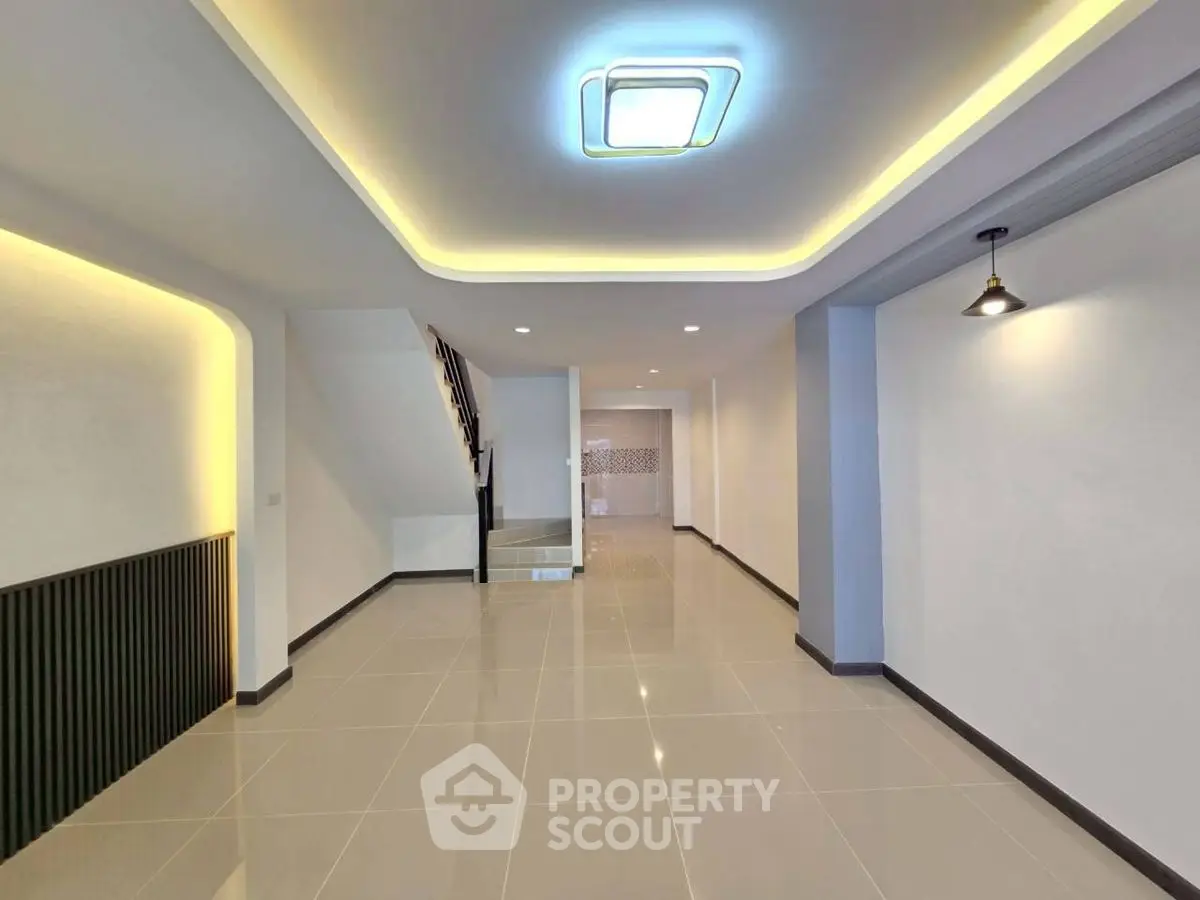 Spacious modern interior with elegant lighting and sleek tile flooring