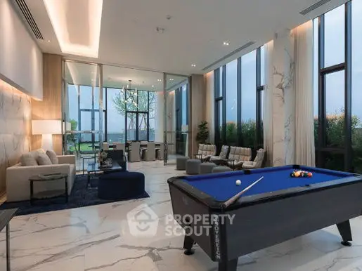 Luxurious modern living room with pool table and floor-to-ceiling windows